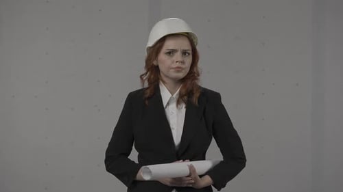 A Woman Architect Looks Around in Shock and Distress Clutching Her Head in Hopelessness Portrait of