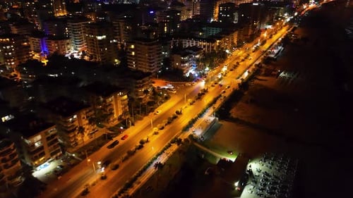 Aerial View Night View of a City with Bright Skyscrapers and LitUp Roads