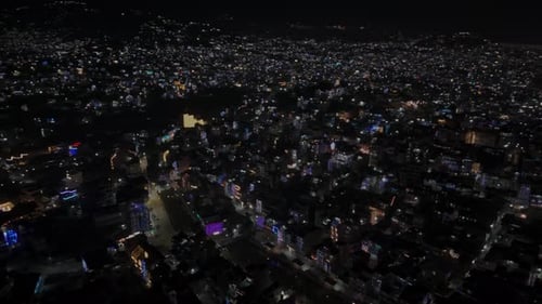 Epic Night Drone View of a Vibrant Sprawling Light Drenched City