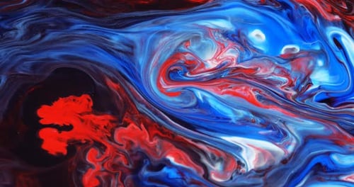 Abstract unique moving background with blue, red paint on a black substrate. Liquid art.