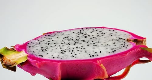 Rotating Dragon Fruit Slice on White Background