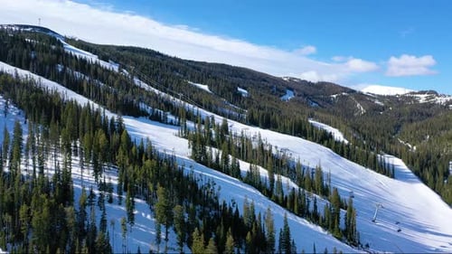 Big Sky’s Alpine Ski Action with Chair Lifts and Trails – Drone View