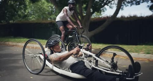 Two Men Riding Bicycles in an Urban Area