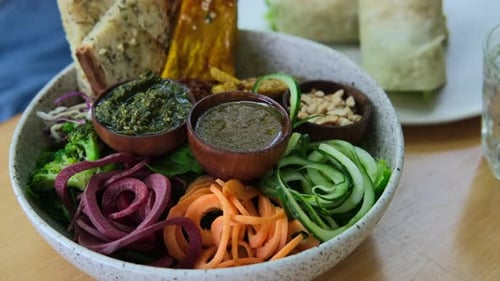 Healthy Bowl of Food with Fresh Vegetables and Dips