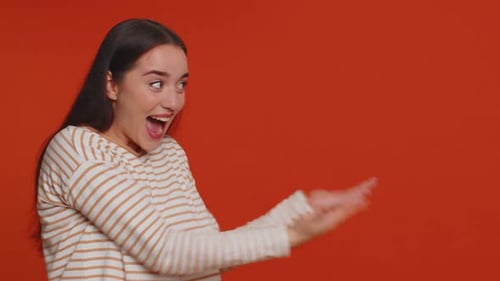 Woman Pointing Empty Place Advertising Area for Commercial Text Copy Space for Goods Promotion