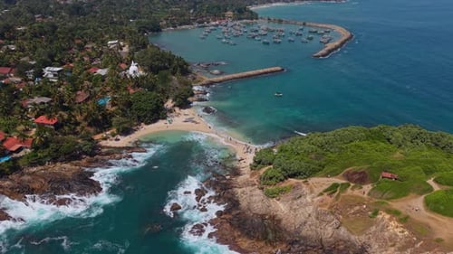 Cinematic footage of fishing village marina along the South coast