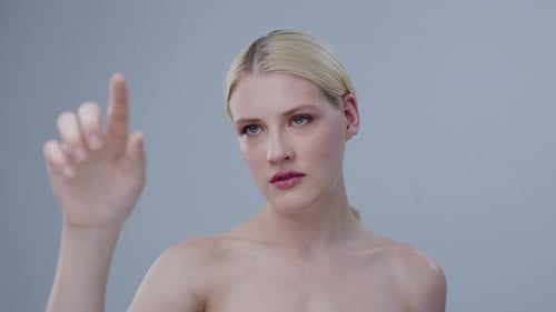 Young Blonde Woman Interacting with Touchscreen