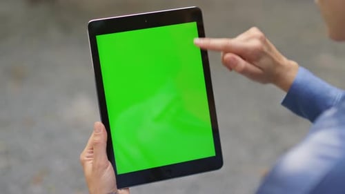 Finger Swiping Green Tablet Screen Closeup Businesswoman Using Chroma Key Pad