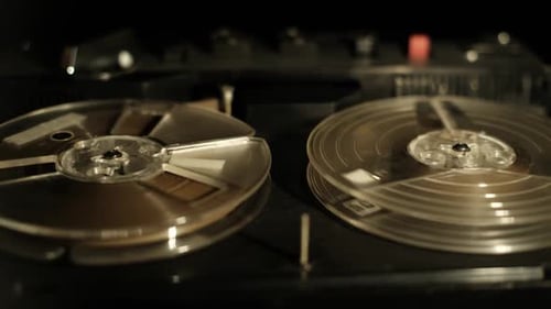 Reel to Reel Tape Spinning on Vintage Player Close Up