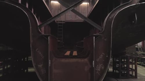 Camera Rises Along Section of Old Ship with Empty Hull