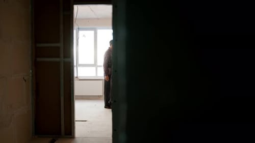 Father and Son Working on Home Renovation Project