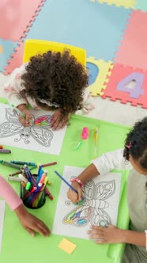 Above, children or coloring in classroom for creativity, art lesson or development for education