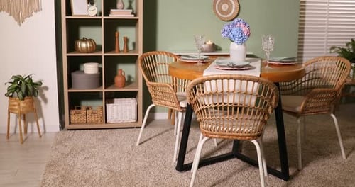 Cozy Dining Room with Wicker Chairs and Round Table