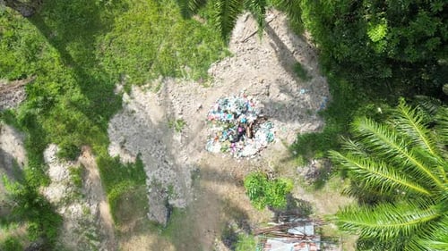 Aerial View of Trash Pile in Tropical Landscape