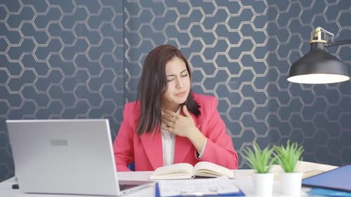 Woman Coughing in Office Workplace Touching Throat