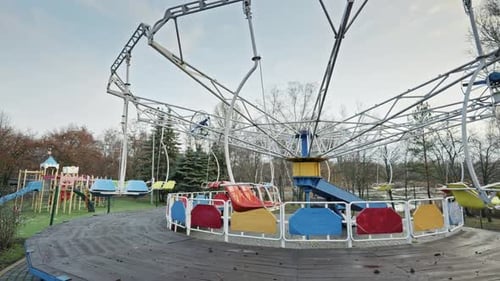 Deserted Swing Carousel at an Old Amusement Park