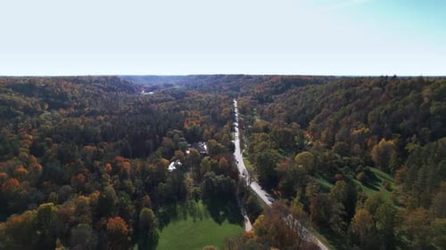 Aerial view of fall colors along a winding country road
