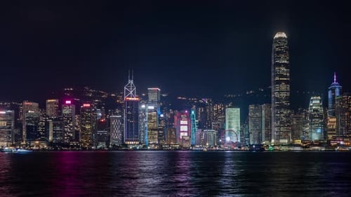 Nighttime Skyline View of Hong Kong Urban Landscape with Illuminated Skyscrapers