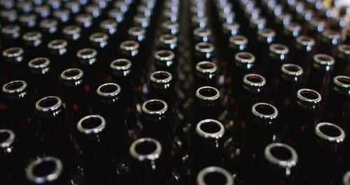 Automated industrial chain of bottles for beer and alcoholic and soft drinks. The concept of indus