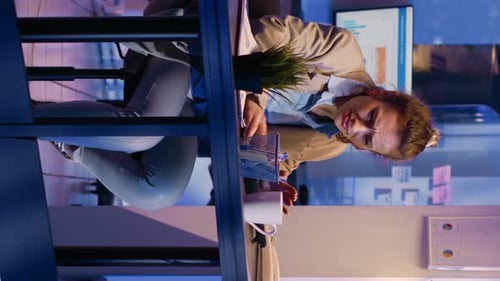 Woman Works Late Analyzing Business Data