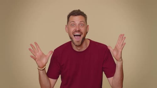Man Reacts with Joy and Astonishment