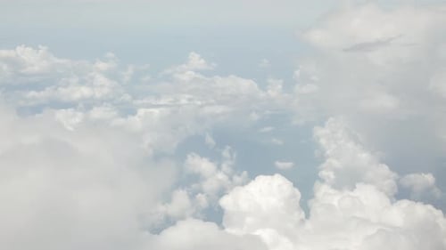 view of sky with white puffy cloud and sun light above sky.cloudscape in summer