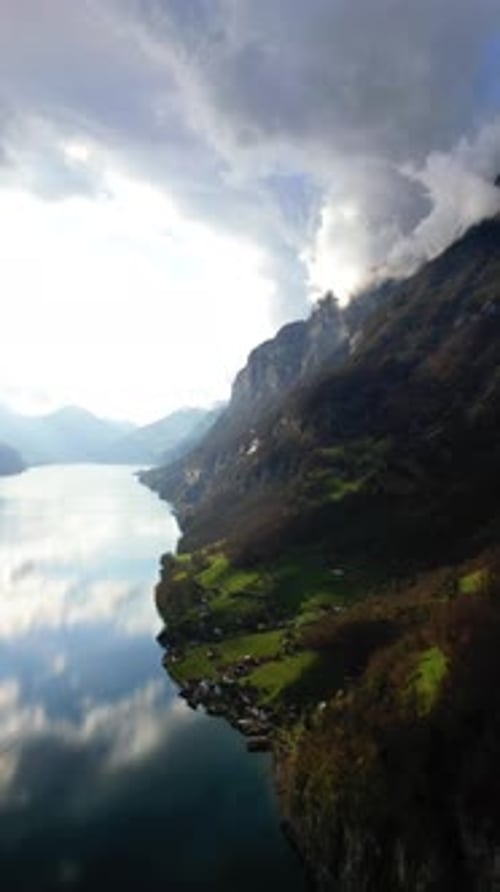 Lake Walen Walensee pristine calm water surface Swiss Alps Churfirsten peak mountains Switzerland