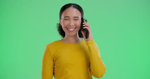 Woman, smile and talking with phone call on green screen for communication
