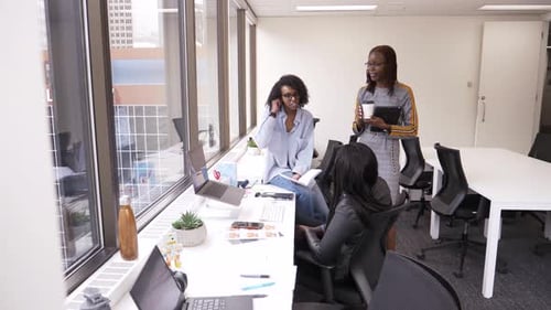 Businesswomen Meeting in Highrise Office