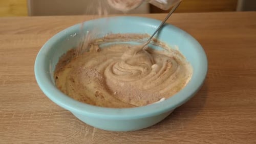 31sm/ Preparation of pastry dough with the addition of cocoa. Making a sweet cake. Slow motion.