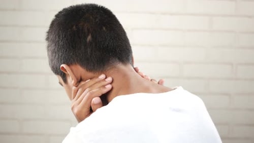 Man Suffering Chronic Neck Pain
