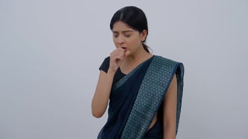 Woman Coughing and Holding Chest in Discomfort