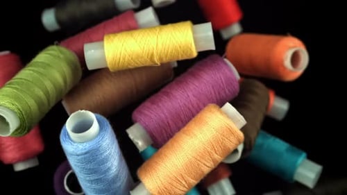 Multicolored Threads Fly on a Black Background Filmed on a Highspeed Camera at 1000 Fps