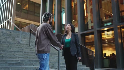 Business Handshake Between Two Colleagues in the City