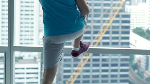 Man Exercising, Doing Warmup By Window In Gym