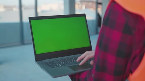 Close Up Hands Engineer Using Laptop Computer with Green Screen Inside Building Worker Project