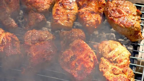 Rack of Meat Being Cooked on Grill
