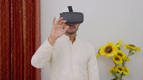 Young Adult Using Virtual Reality Headset Indoors