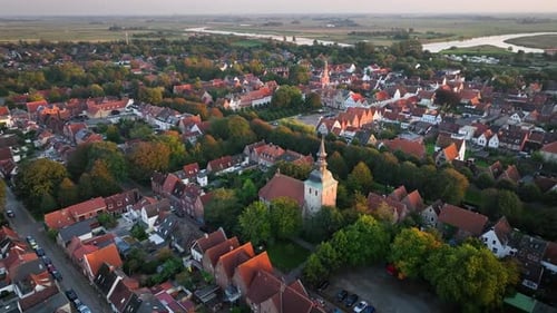 Aerial orbit of St. Christopher's Church in Friedrichstadt, a charming Dutch-style town in Schleswig