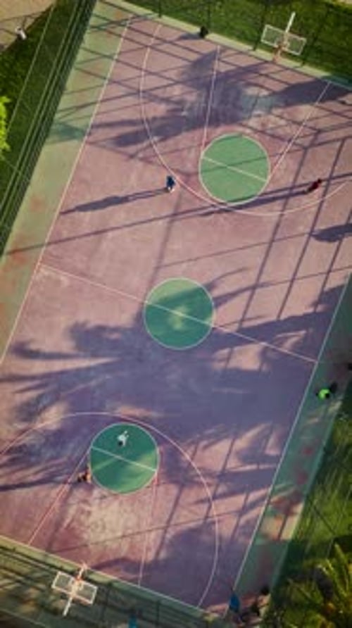 Aerial View of Basketball Players on Outdoor Court
