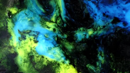 view of glowing green and blue substances mixing in a surreal liquid swirl