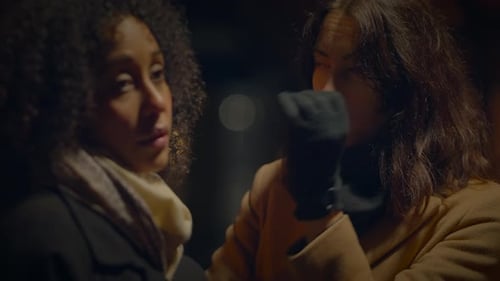 Women Having an Emotional Discussion at Night