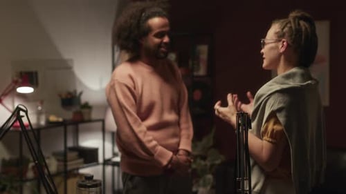 Two Diverse Radio Hosts Chatting in Night Studio
