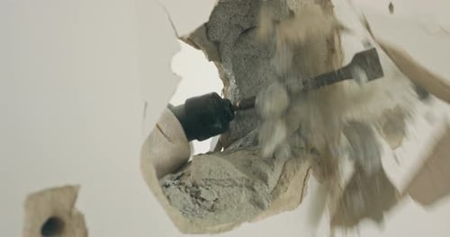 Closeup of the Hole in the Wall Which is Demolished By a Handheld Jackhammer