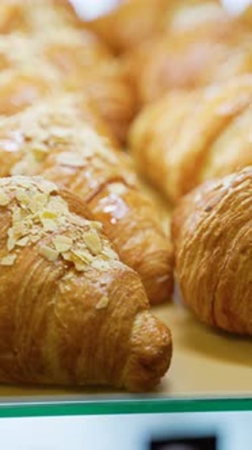 Delicious Freshly Baked Croissants Placed on Counter in Bakery