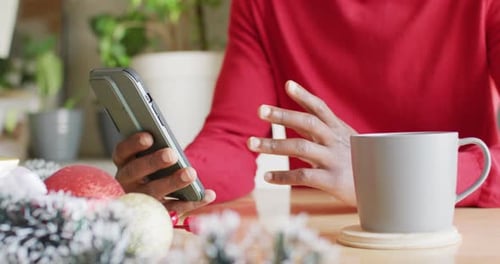 Man Using Smartphone During the Holiday Season