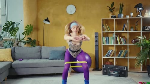 Woman Exercising at Home with Resistance Band