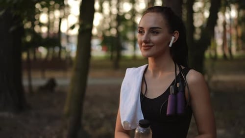 Fitness Woman with Jump Rope in Green Park