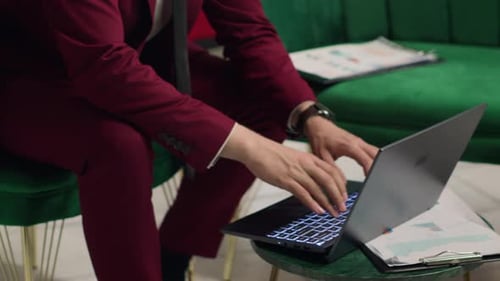 Business Manager Reviews Papers at Hotel