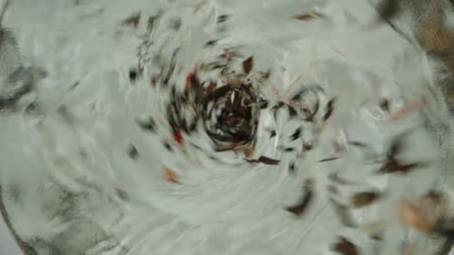 Swirling Water with Dark Debris from Above